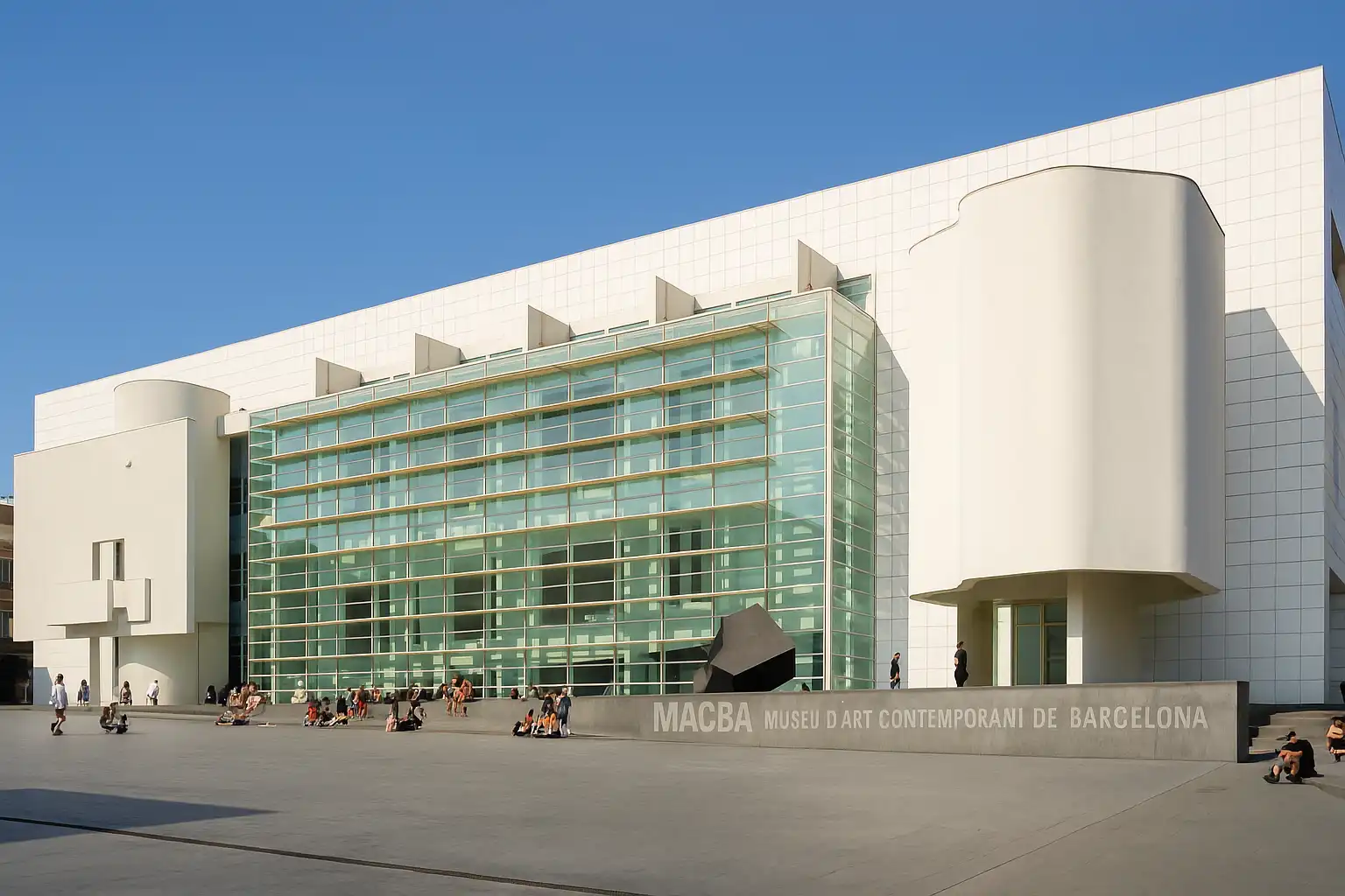 Exterior of MACBA in Barcelona with white modern façade and open plaza in El Raval